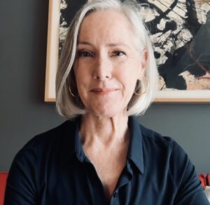 Profile of Ann Johnson, a white woman with grey hair cut in a bob to her chin.